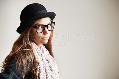 Buy stock photo Portrait, hat and woman in glasses for fashion in studio isolated on a white background mockup space. Face, eyewear and serious girl, model and young person in stylish scarf for beauty in Switzerland