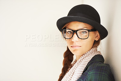 Buy stock photo Portrait, hat and serious woman in glasses for fashion in studio isolated on a white background mockup space. Face, eyewear and confident girl, model or young person in stylish clothes in Switzerland