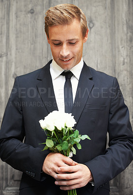 Buy stock photo Love, man and bunch of white roses, smile and gift for date, relationship and guy with joy. Romance, male and gentleman with suit, plants or flowers for wedding, happiness or celebration with bouquet