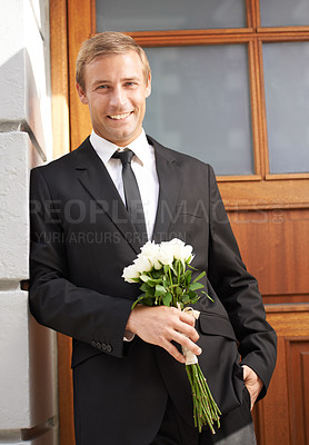 Buy stock photo Love, portrait and man with flowers for valentines day, romance or gesture while standing against a wall background. Roses, happy and gentleman with bouquet for sweet, anniversary gift or first date 