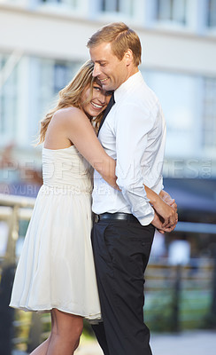 Buy stock photo Love, couple and hug outdoor, city and happiness for Valentines day, dating and cheerful together. Romance, man and woman embrace in town, celebrate relationship and happy with hope and marriage