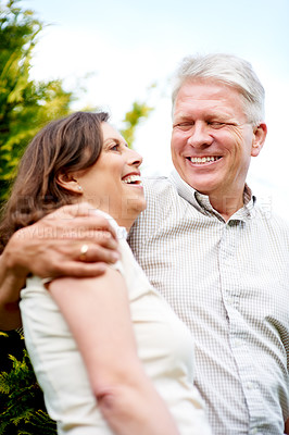 Buy stock photo Senior couple, happy and laughing with hug, marriage and embrace in outdoor, retired or smile. Retirement, elderly or love with face, bonding together or joke for romantic relationship, man or woman