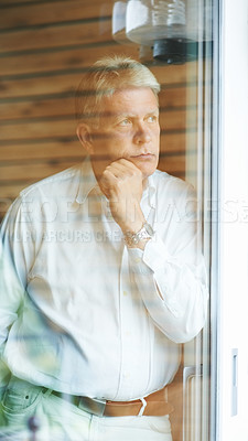 Buy stock photo Mature man at window, thinking and sad in home with doubt, anxiety for decision and lonely memory. Stress, worry and worried senior person with insight, reflection and ideas for retirement in bedroom
