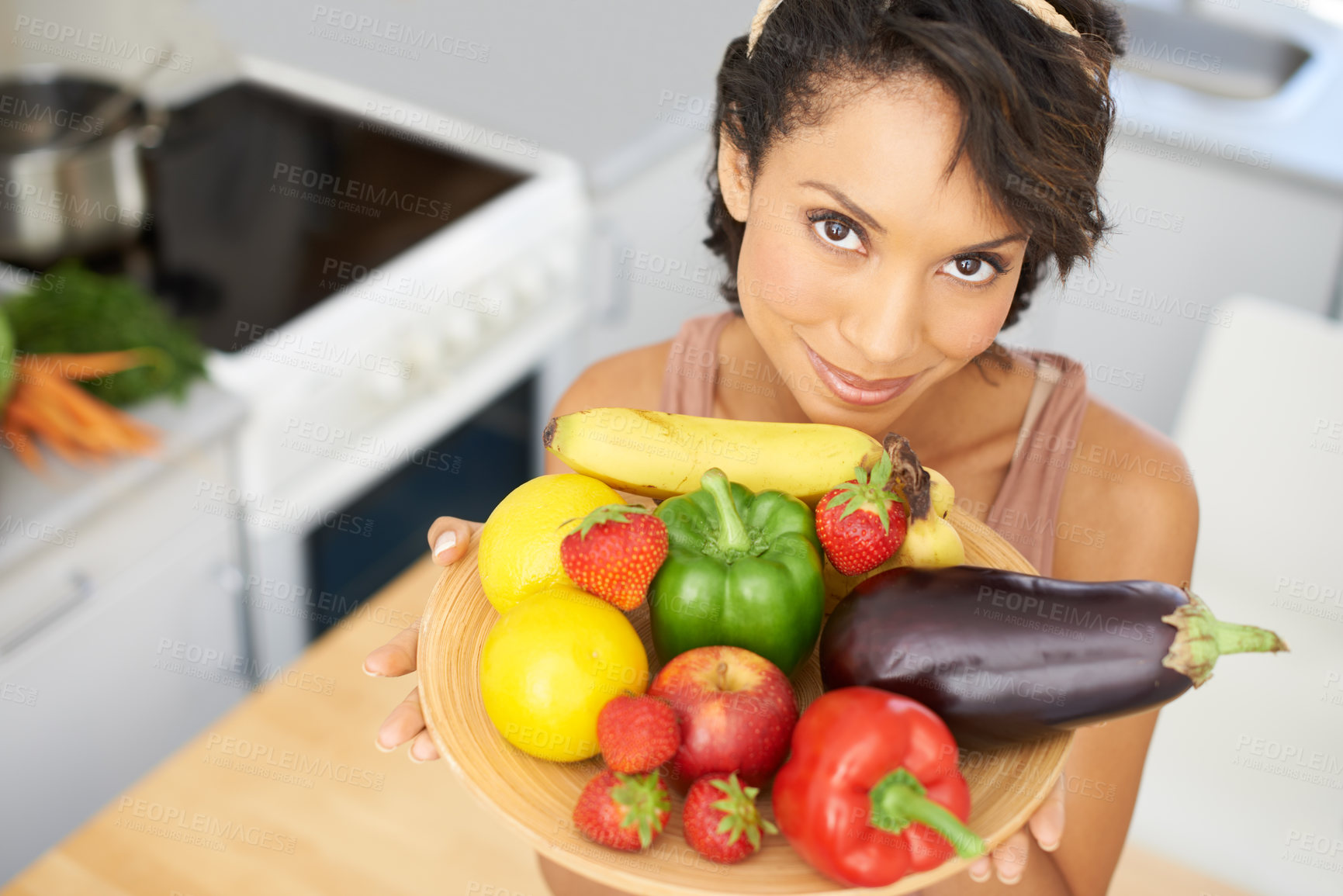 Buy stock photo Portrait, health and vegetables with a woman in the kitchen of her home for nutrition, diet or meal preparation. Face, ingredients and a recipe for cooking food with a young person in her apartment