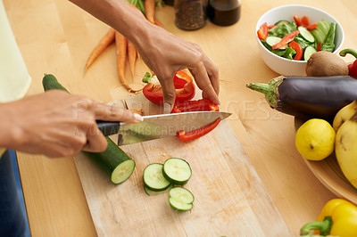 Buy stock photo Closeup, hands and cutting with vegetables, nutrition and plant based diet in a kitchen. Person, home and cooking health food, lunch and vegan meal with variety, vitality and weight loss with knife