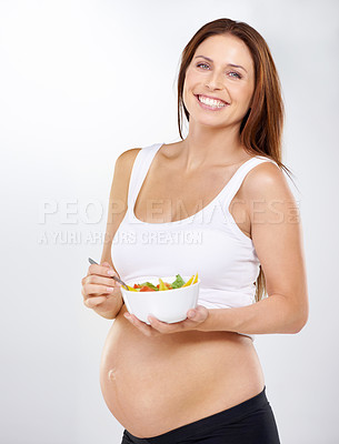 Buy stock photo Portrait, salad and pregnant with woman, nutrition and smile on a studio white background. Person, bowl and model with happiness, girl and pregnancy with vegetables, vitamins and maternal with meal