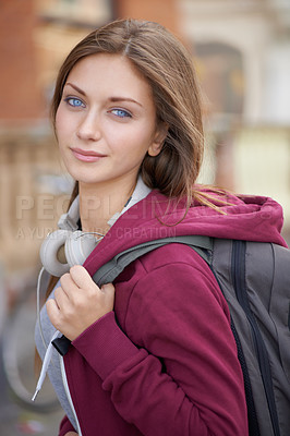 Buy stock photo A lovely young woman turning to give you a sweet smile