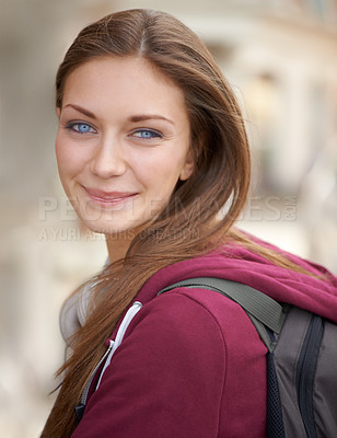 Buy stock photo Portrait of woman on campus with backpack, smile and university, opportunity and education. Relax, happiness and face of college student on morning commute to school with confidence, pride and future