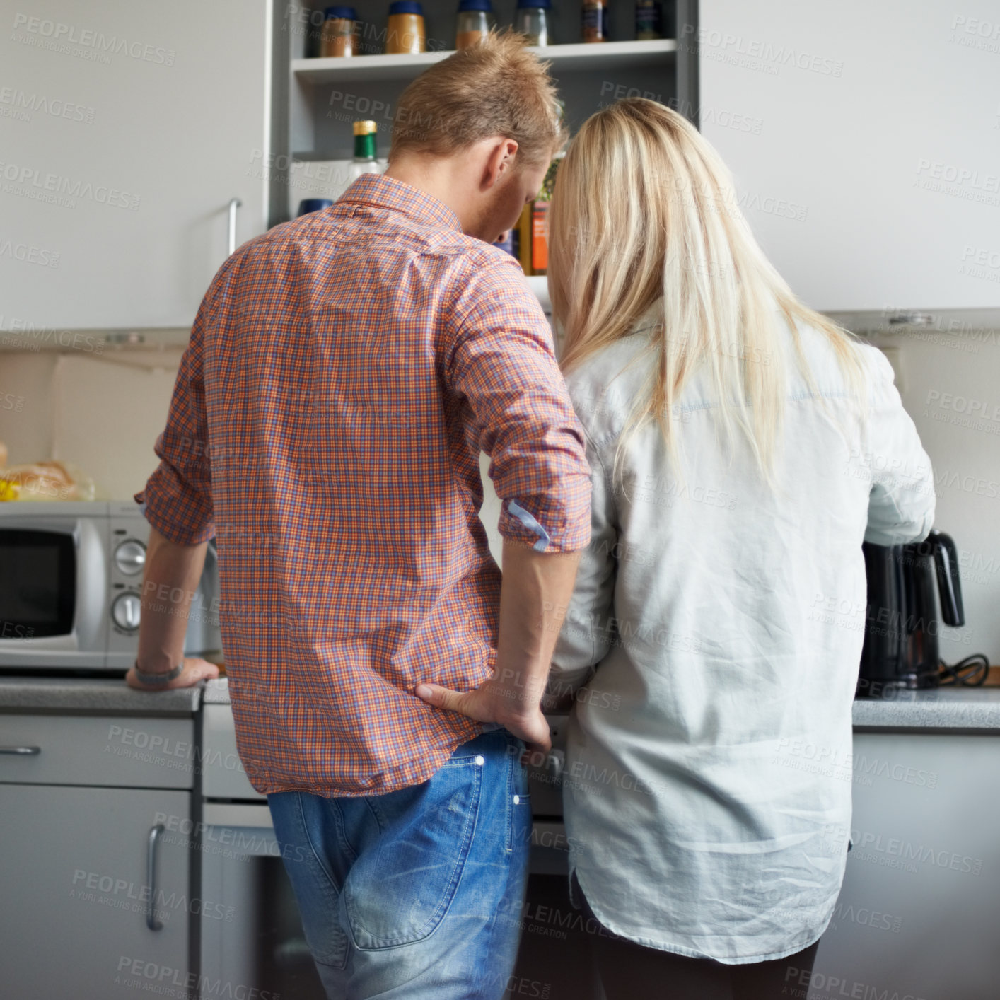 Buy stock photo Cooking, back and couple in a kitchen for breakfast, meal or bonding at home together. Love, food and rear view of people in a house for meal prep, brunch or preparing dinner on weekend or day off