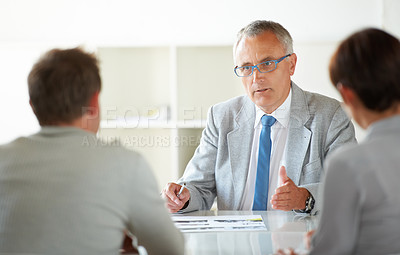 Buy stock photo Man, leader and discussion at business meeting, conversation and feedback or review in training. Mature businessman, employees and communication in workshop, agenda and planning for future growth