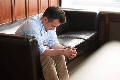 Buy stock photo Businessman, sad and sofa in office for unemployment, job loss mistake or failure anxiety. Male person, stress thinking and head low on couch for disappointed problem at work, frustrated or grief