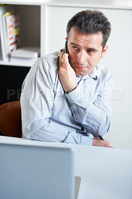 Buy stock photo Businessman, phone and secret call in office private information, confidential or sneaky discussion. Male person, mobile or talk at laptop for inside trade, crime job or company online security break