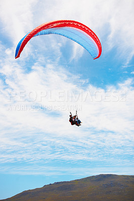 Buy stock photo People, paragliding and freedom in sky, mountain or extreme sport with smile for fitness. Coach, partnership and person on adventure, clouds or fearless with backpack, parachute or flight in summer