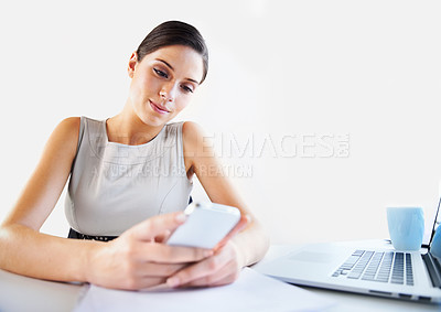 Buy stock photo Office, social media or businesswoman on a phone for reading data, news update or mobile app report. Laptop, paperwork documents or worker on website to research or chat on blog on break to relax