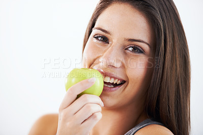 Buy stock photo Woman, portrait and eating apple in studio for nutrition, healthy food and clean detox on white background. Face of happy model with fruits for vegan diet, vitamin c and lose weight on mockup space 