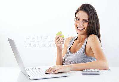 Buy stock photo Portrait, laptop and woman nutritionist with apple in studio for wellness, diet or eating plan on white background. Weight loss, face and female health influencer with blog survey, help or menu guide