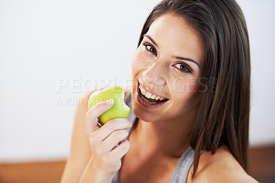 Buy stock photo Woman, smile and eating an apple, health and wellness in portrait, nutrition and vitamins for vegan. Female person, fruit and organic or natural, breakfast and diet in outdoors, fresh and digestion
