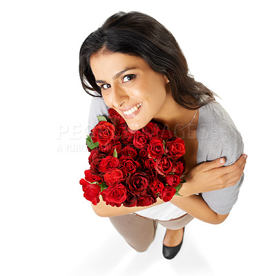 Buy stock photo Above, portrait and woman with rose in studio for love, romance and valentines day on white background space. Happy, smile and bouquet for indian girl face hug floral, gesture and romantic isolated