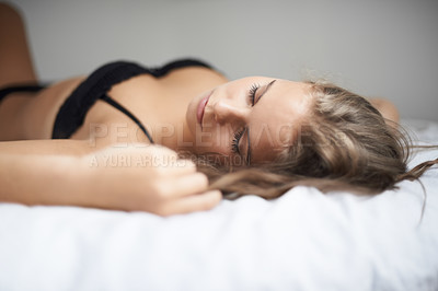 Buy stock photo Lingerie, woman and bed with sleeping, rest and relax in a bedroom with underwear and calm. Sexy, fashion and confidence with nap at home on a blanket and sheets lying down with peace and bra