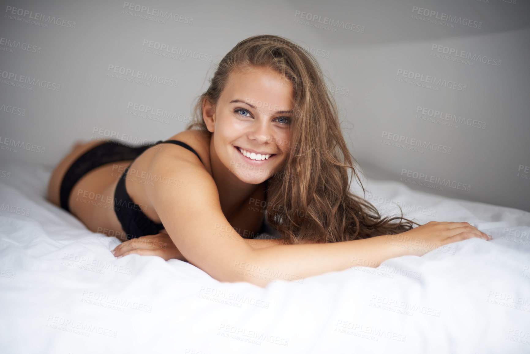 Buy stock photo Portrait, smile and bed with woman, lingerie and sexy with wellness, vacation and relax. Face, person and girl in a bedroom, underwear and holiday with weekend break, hospitality or cheerful with joy