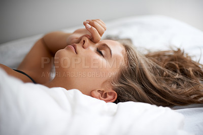 Buy stock photo Sleeping, peace and tired woman relax in a bed calm, resting and dreaming in her home or apartment. Fatigue, face female person lying in bedroom for burnout recovery, nap or weekend comfort in house