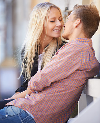 Buy stock photo Couple, love or kiss in city with smile, relax or weekend date for romance outdoor in sun. English man, woman or bliss in connection in relationship, marriage or care in bond together in cambridge
