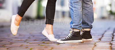 Buy stock photo Love, city and shoes of couple on road for date, cute relationship and bonding outdoors on weekend. Dating, romance and closeup of feet of man and woman for flirting, shy and romantic adventure