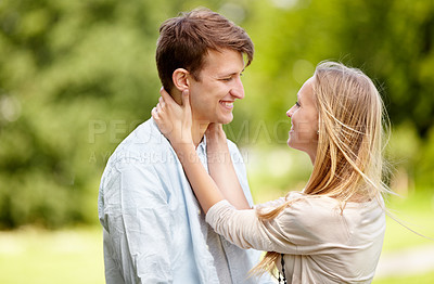 Buy stock photo Park, happy and couple smile, eye contact and in nature, natural garden or romance date for freedom, love or bond. Partner, spring and relax man, woman or people together for care, support or embrace
