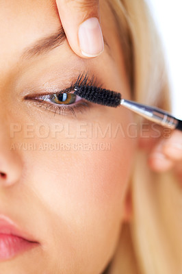 Buy stock photo Makeup, mascara and woman with hands in studio for volume, care or professional application closeup. Eyelash extension, beauty and eyes of model with beautician for glam, texture or transformation