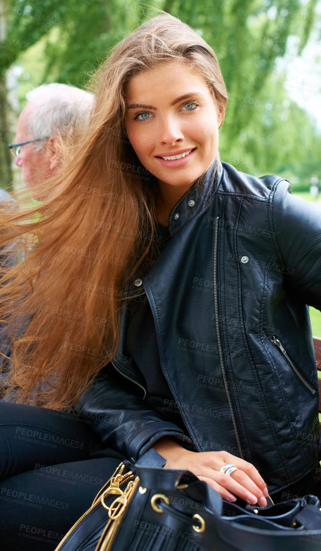 Buy stock photo Outdoor, woman and portrait with fashion with style and trendy clothing with confidence. Park, garden and happy with a smile from female model from Germany with leather jacket and modern bag
