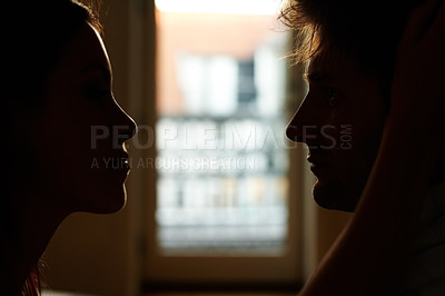 Buy stock photo Home, silhouette and couple with love, relationship and shadow with profile, bonding together and romance. People, man and woman with eye contact, marriage and support with care, date and romantic