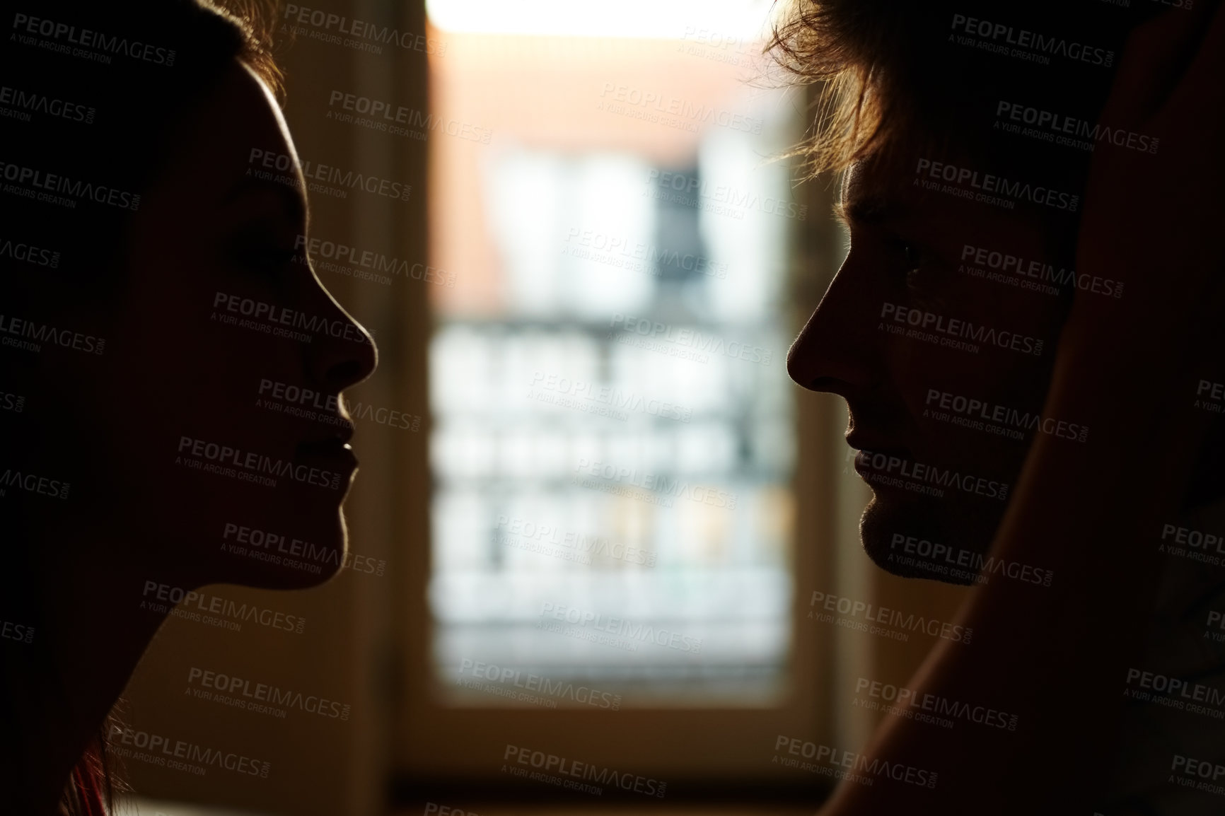Buy stock photo Home, silhouette and couple with love, relationship and shadow with profile, bonding together and romance. People, man and woman with eye contact, marriage and support with care, date and romantic