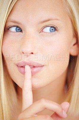 Buy stock photo Woman, secret and finger on lips with thinking for sign, choice or deal with idea for skincare by background. Girl, hand and mouth for icon, whisper or gossip for decision, news or privacy in closeup
