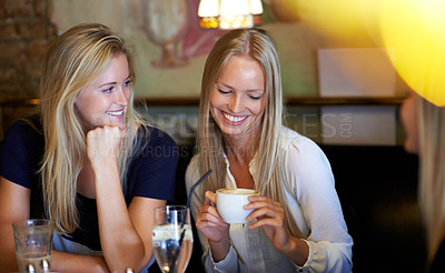 Buy stock photo Relax, women and coffee shop with conversation, smile and cheerful with weekend break, social gathering and talking. People, friends and girl in a cafe, speaking and laughing with discussion or latte