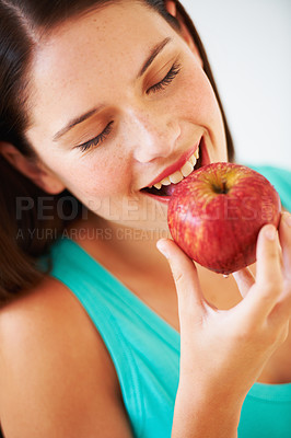 Buy stock photo Health, diet and face of woman with apple eating for nutrition, wellness and snack in studio. Food, happy and person with fruit for vitamins, detox benefits and lose weight on white background