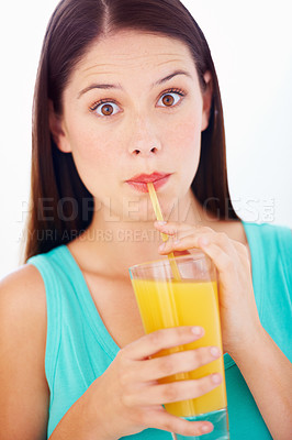 Buy stock photo Shock, drinking and portrait of woman with juice for nutrition, wellness and hydration in studio. Surprise, comic and face of person with fruit blend for vitamins, detox and diet on white background