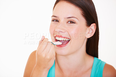 Buy stock photo Eating, yogurt and portrait of woman with healthy food, diet or nutrition in studio with happiness. Happy, face and girl with spoon, yoghurt or strawberry flavor of dairy for breakfast calcium snack