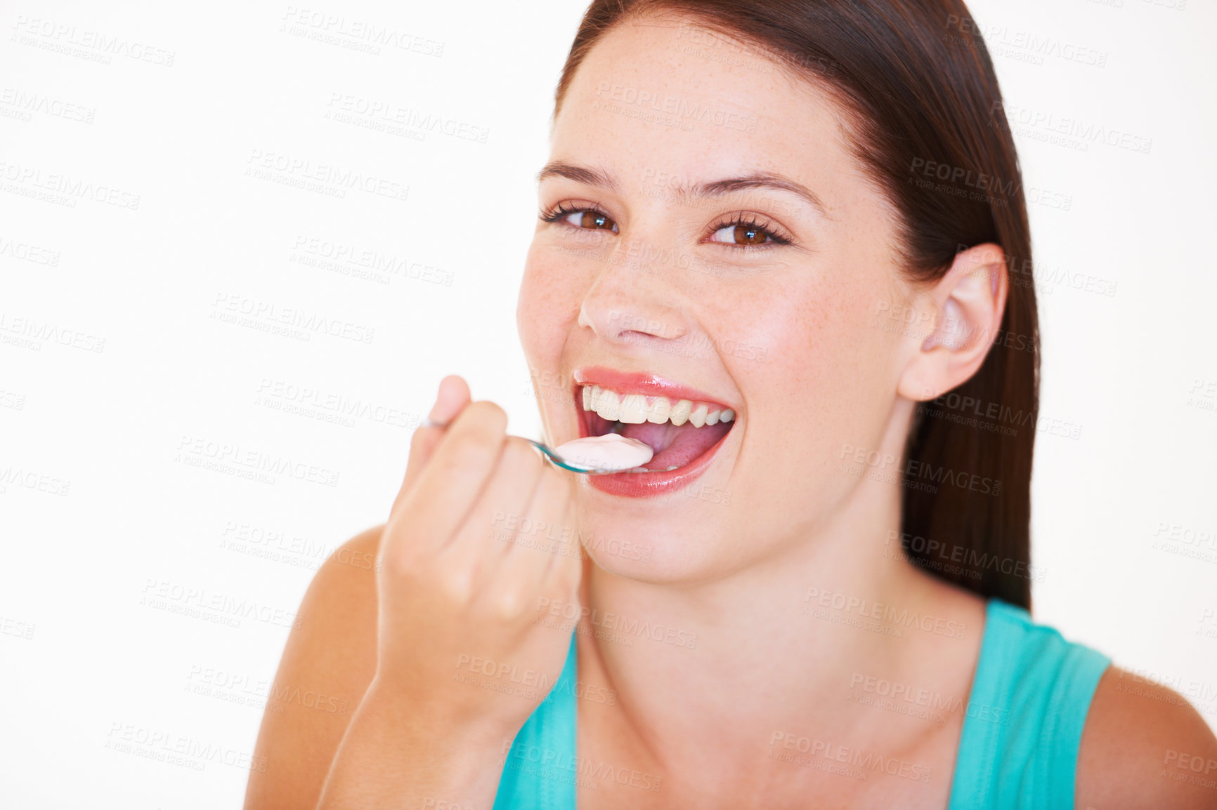 Buy stock photo Eating, yogurt and portrait of woman with healthy food, diet or nutrition in studio with happiness. Happy, face and girl with spoon, yoghurt or strawberry flavor of dairy for breakfast calcium snack