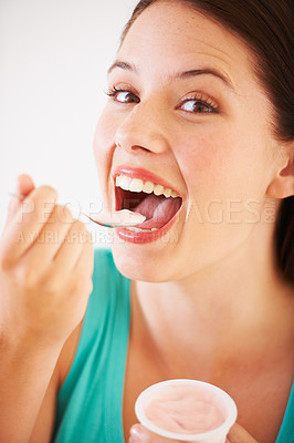 Buy stock photo Eating, yogurt and portrait of woman with healthy food, diet or nutrition in studio with happiness. Happy, face and girl with spoon, yoghurt and strawberry flavor of dairy, product or snack for lunch