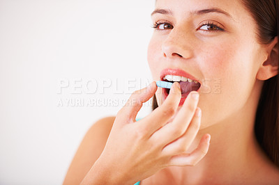 Buy stock photo Healthy, woman and portrait with pill, tablet and supplements for nutrition, diet or vitamin c benefits. Happy, face and girl eating pharmaceutical capsule with omega 3, iron and healthcare medicine