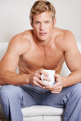 Buy stock photo Portrait, home and man with coffee, couch and relax with peace, carefree and morning tea in a lounge. Face, guy and person with espresso, shirtless or comfortable with latte, warm drink or confidence