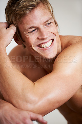 Buy stock photo Face, smile and a shirtless man closeup in studio isolated on a gray background for heath or fitness. Skin, body and a happy young model looking satisfied with exercise or training for wellness