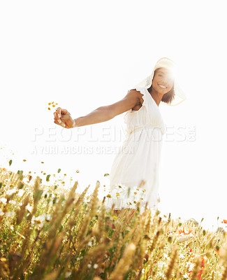 Buy stock photo Portrait, smile and woman in field with flowers in the countryside in summer. Happy person in hat, nature and wheat farm or garden on lens flare, mockup and travel on holiday or vacation in Brazil