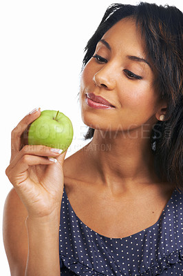 Buy stock photo Health, apple and smile with black woman thinking for diet, nutrition or organic choice. Food, vitamins and fiber snack with isolated Brazil girl and fruit for natural, weight loss or clean eating