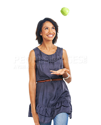 Buy stock photo Woman, studio and throw apple in air with smile, nutrition and diet with fashion, happiness and white background. Black woman, health and natural green fruit for detox, energy or wellness by backdrop