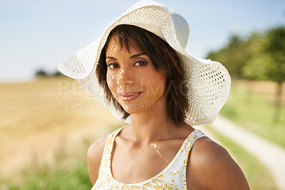 Buy stock photo Portrait, smile and woman in hat at field in the countryside in summer outdoor, beauty or health. Face, happy and young person in nature, farm and garden to travel on holiday or vacation in Brazil