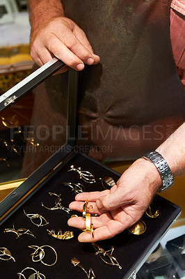 Buy stock photo Cropped view of a jeweler showing his handiwork