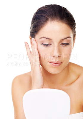 Buy stock photo Woman, face and mirror for skincare, makeup or beauty product isolated against a white studio background. Female person or model applying treatment for facial glow, cleanse or anti aging cosmetics