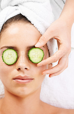 Buy stock photo Woman, hand and cucumber on eyes for wellness, cosmetic or spa therapy with closeup, relax and peace. Person, skincare or detox treatment for beauty, skin or stress relief and relaxation or wellbeing