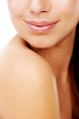Buy stock photo Body, skincare and woman closeup in shower with shoulder, hygiene and white background for dermatology in studio. Girl, water and cosmetics treatment for health, wellness or wet glow on clean skin